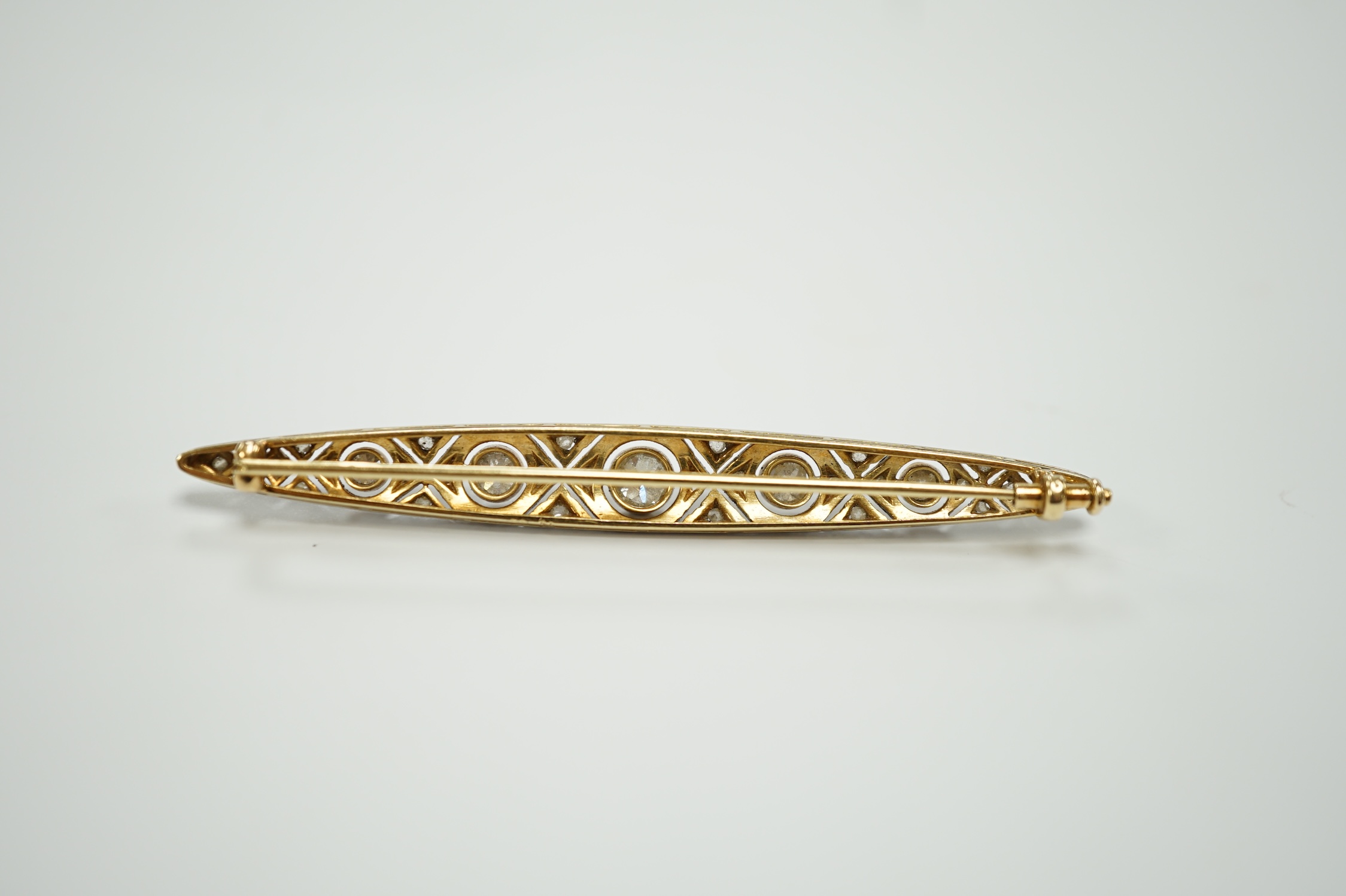 A Belle Epoque yellow and white metal mounted diamond cluster set navette shaped bar brooch, 69mm, gross weight 6.5 grams.